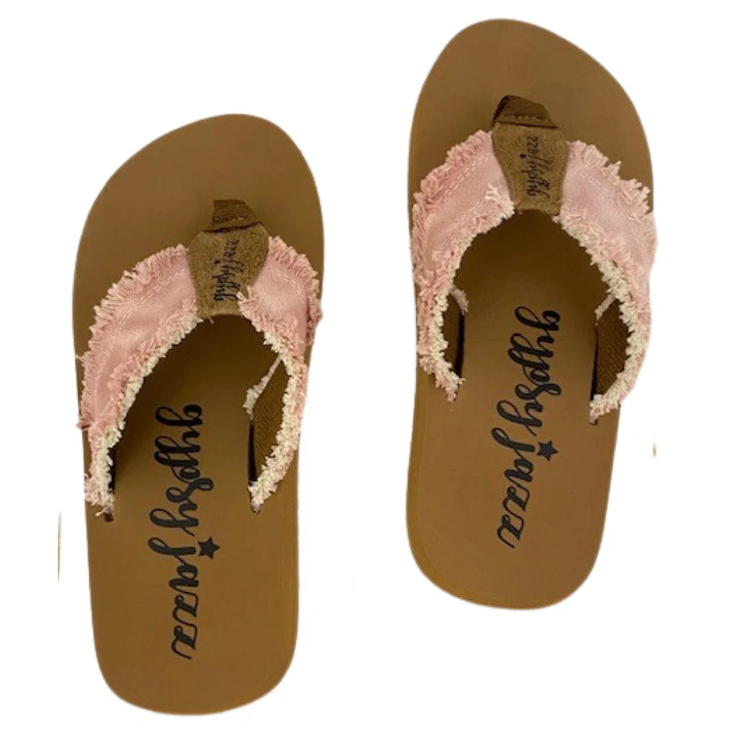 Blush flip flops with textured straps and frayed edges, perfect for summer outings and vacations.