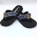 Navy flip flops with a star pattern strap and a black sole, featuring a stylish frayed edge design.
